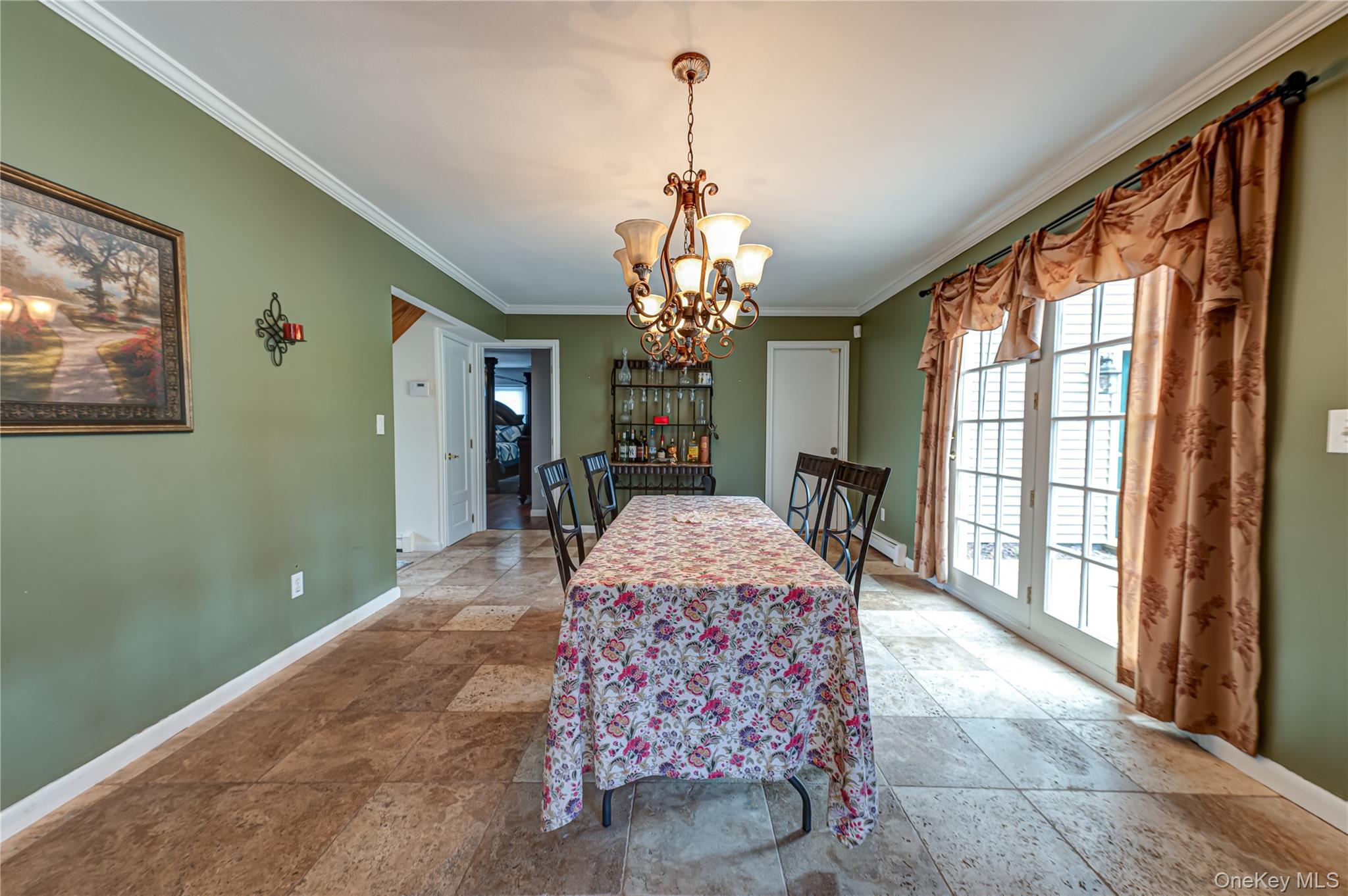 114 Randall Road Ridge, NY 11961 - Photo 16 of 48 a living room with furniture and a chandelier