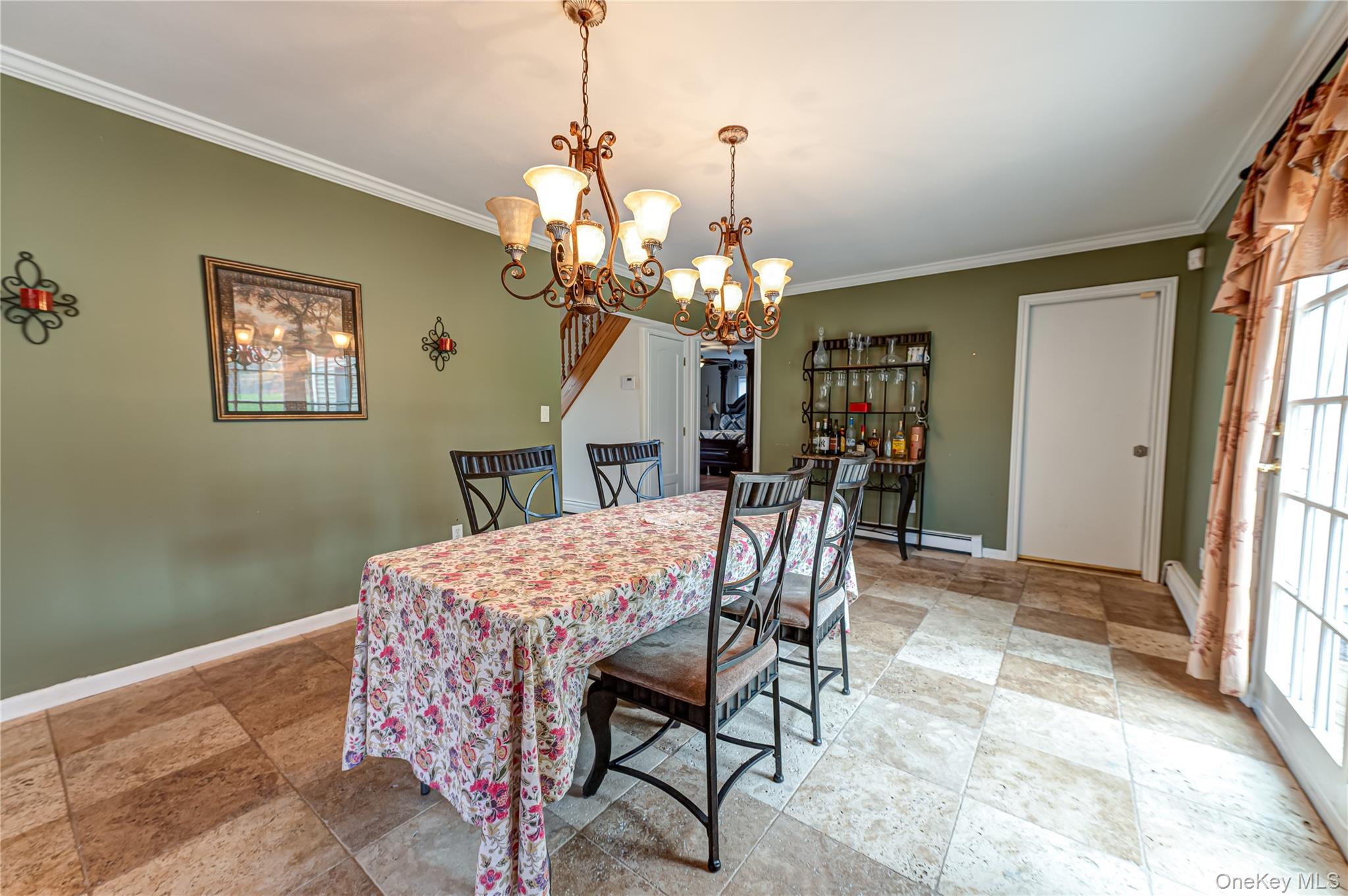 114 Randall Road Ridge, NY 11961 - Photo 17 of 48 a view of a dining room with furniture and chandelier