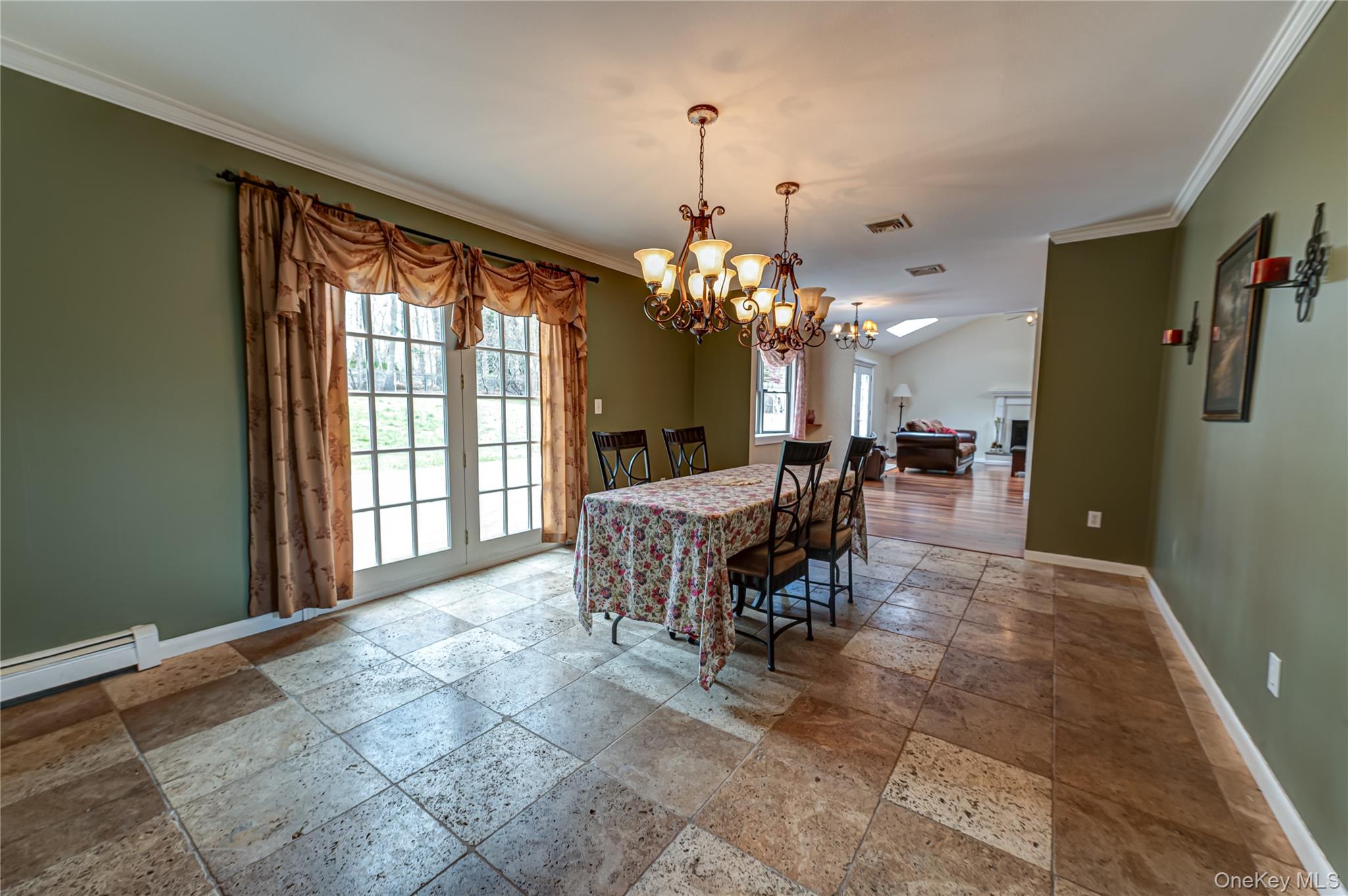 114 Randall Road Ridge, NY 11961 - Photo 18 of 48 a dining room with furniture a chandelier and window