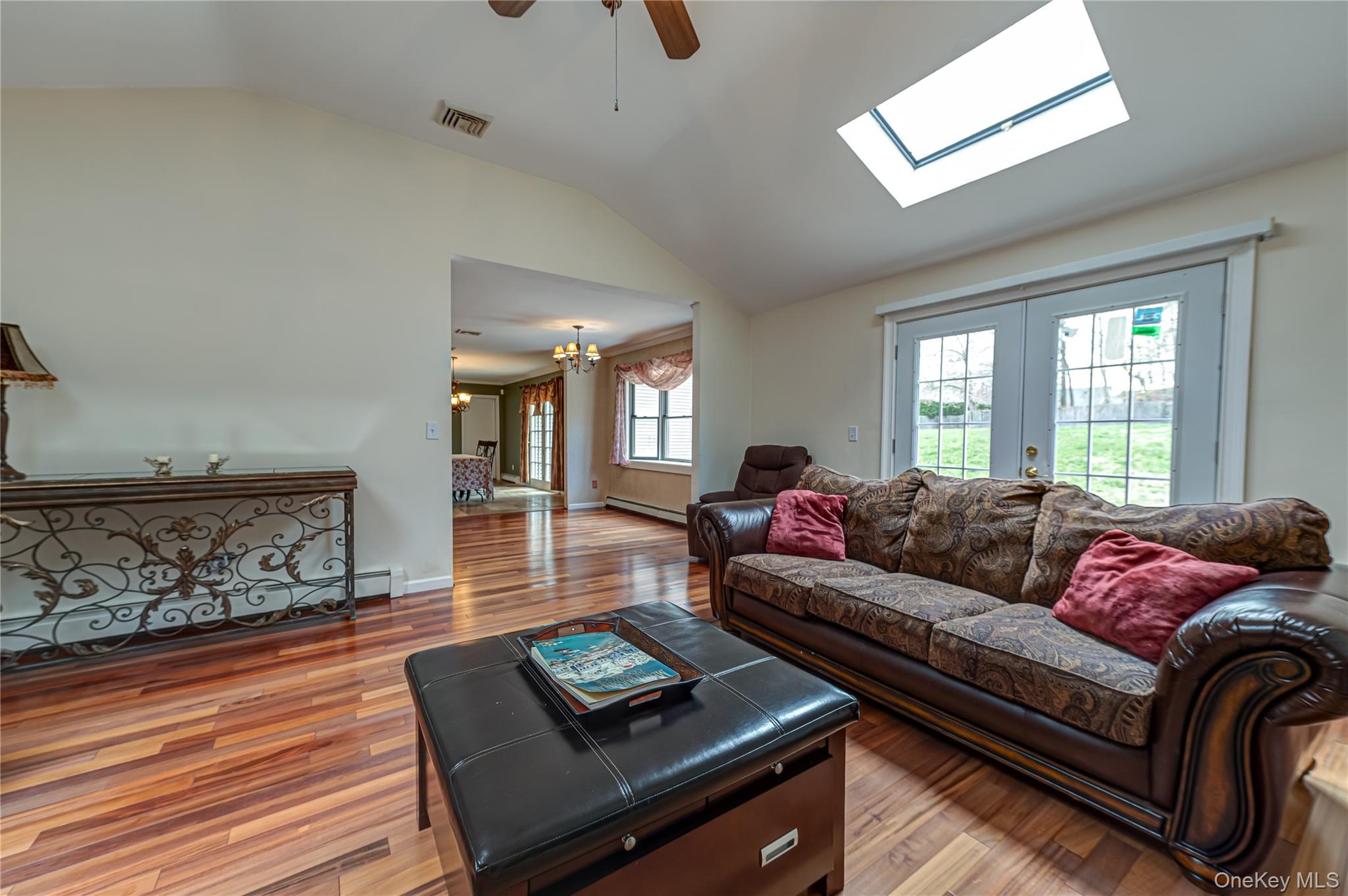 114 Randall Road Ridge, NY 11961 - Photo 19 of 48 a living room with furniture and a wooden floor