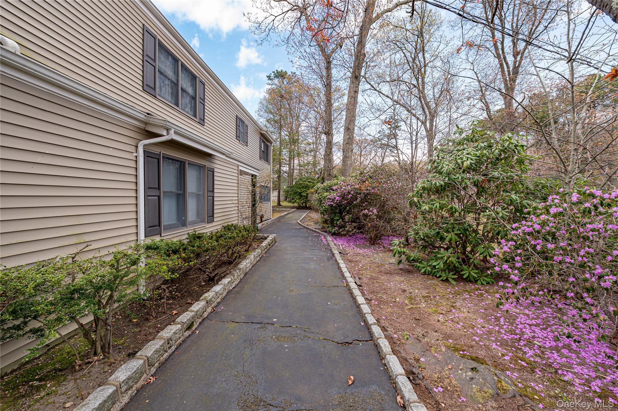 114 Randall Road Ridge, NY 11961 - Photo 2 of 48 a view of a pathway with a house