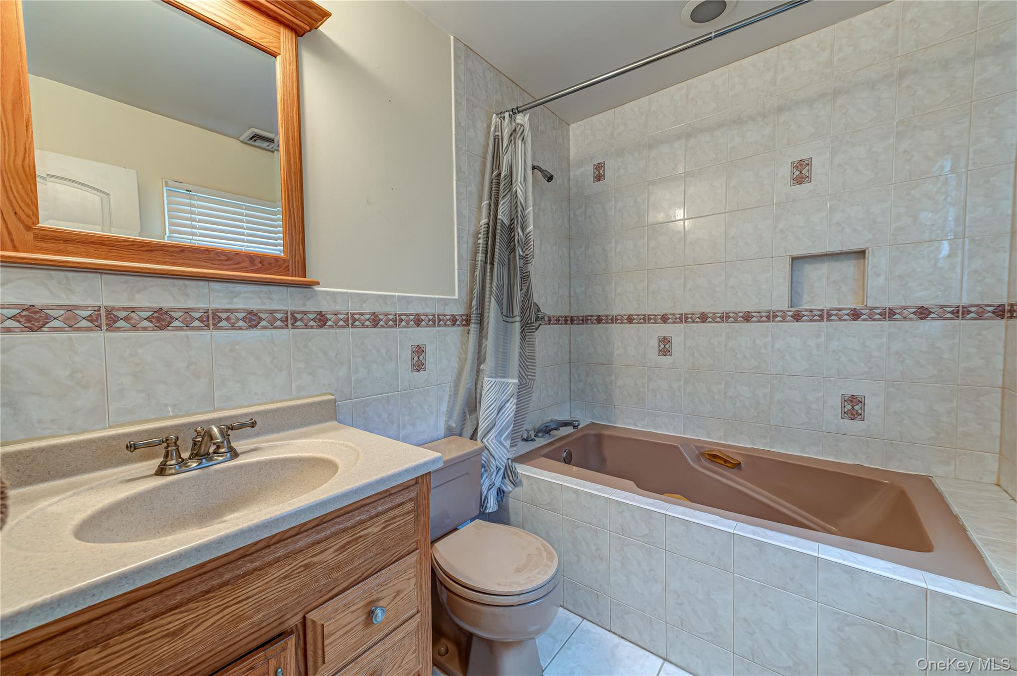 114 Randall Road Ridge, NY 11961 - Photo 22 of 48 a bathroom with a sink a toilet and a bathtub