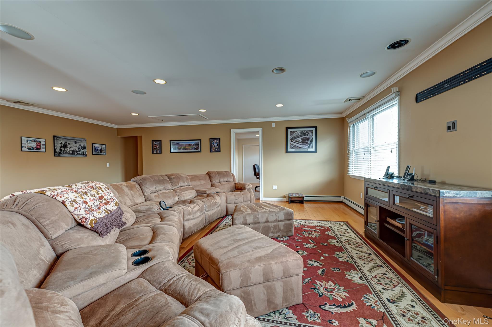 114 Randall Road Ridge, NY 11961 - Photo 25 of 48 a living room with furniture and a flat screen tv