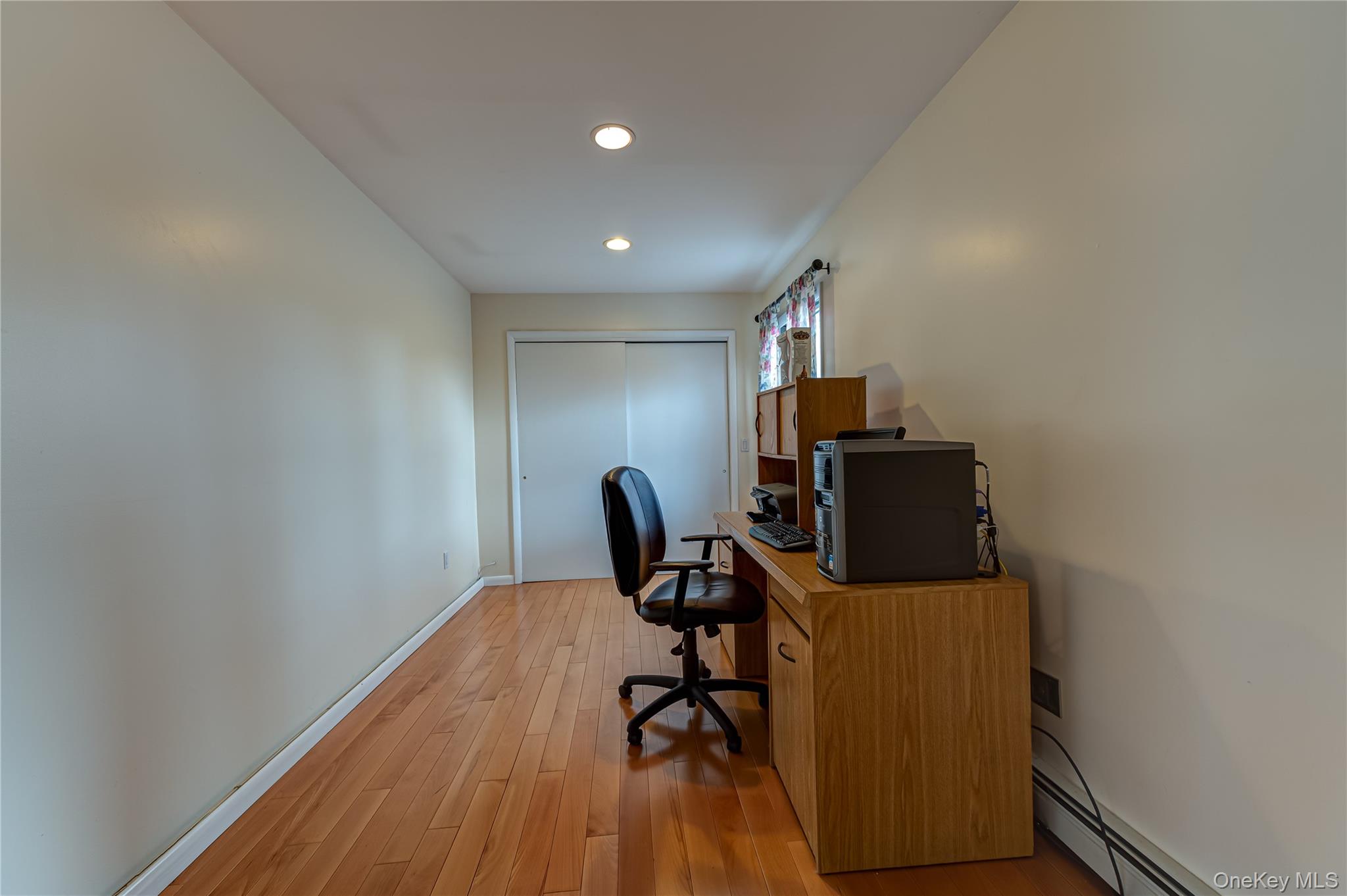 114 Randall Road Ridge, NY 11961 - Photo 26 of 48 a view of workspace with wooden floor windows