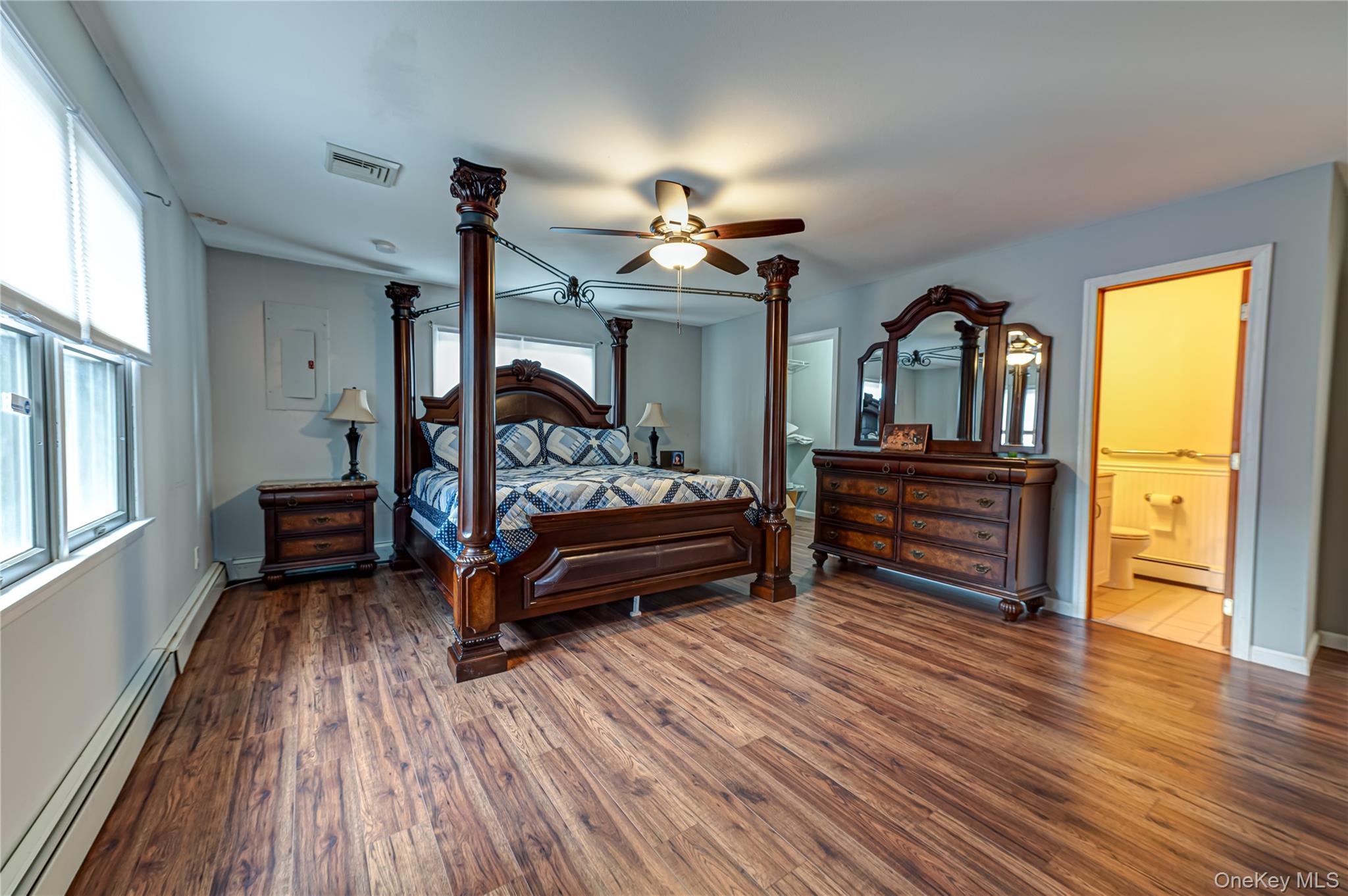 114 Randall Road Ridge, NY 11961 - Photo 31 of 48 a bedroom with furniture and wooden floor