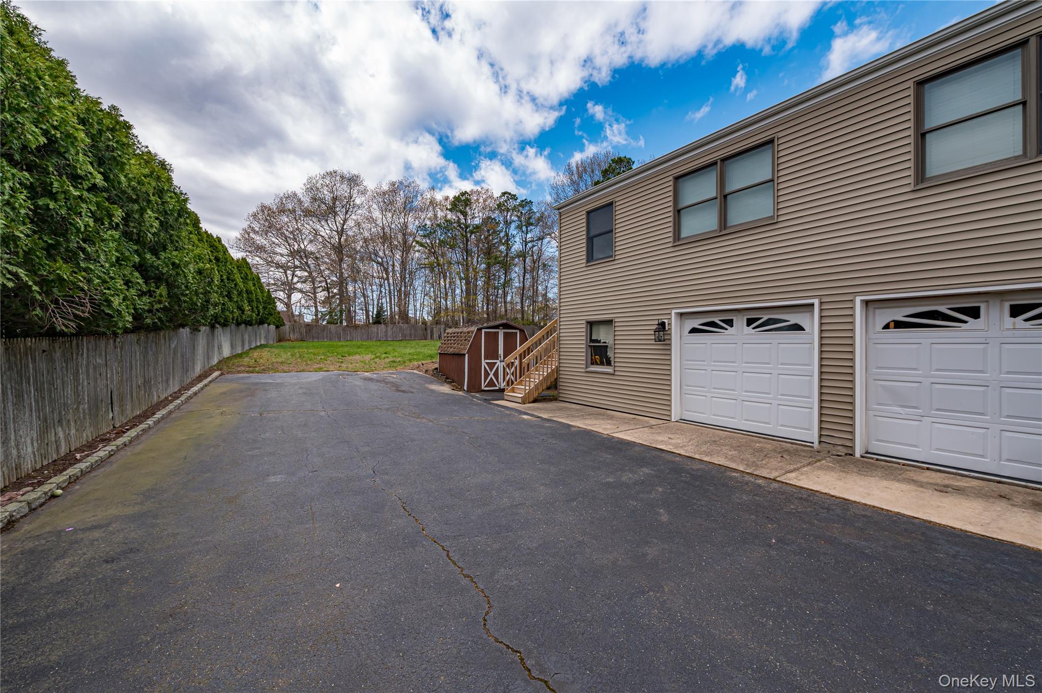 114 Randall Road Ridge, NY 11961 - Photo 4 of 48 a view of a house with backyard and trees