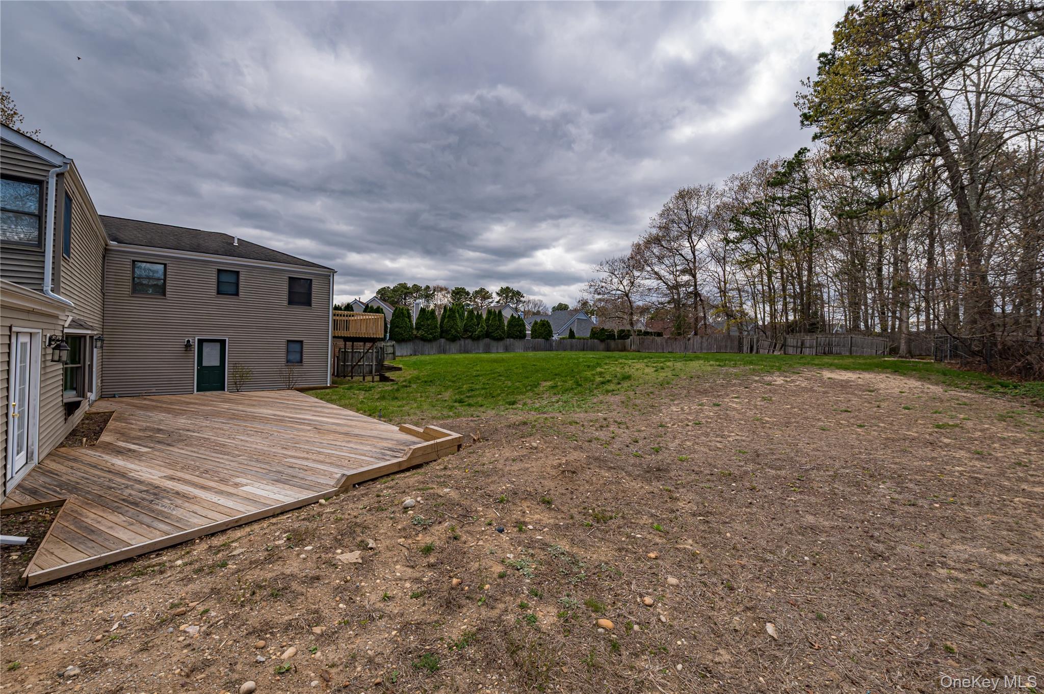 114 Randall Road Ridge, NY 11961 - Photo 42 of 48 a view of a backyard of the house