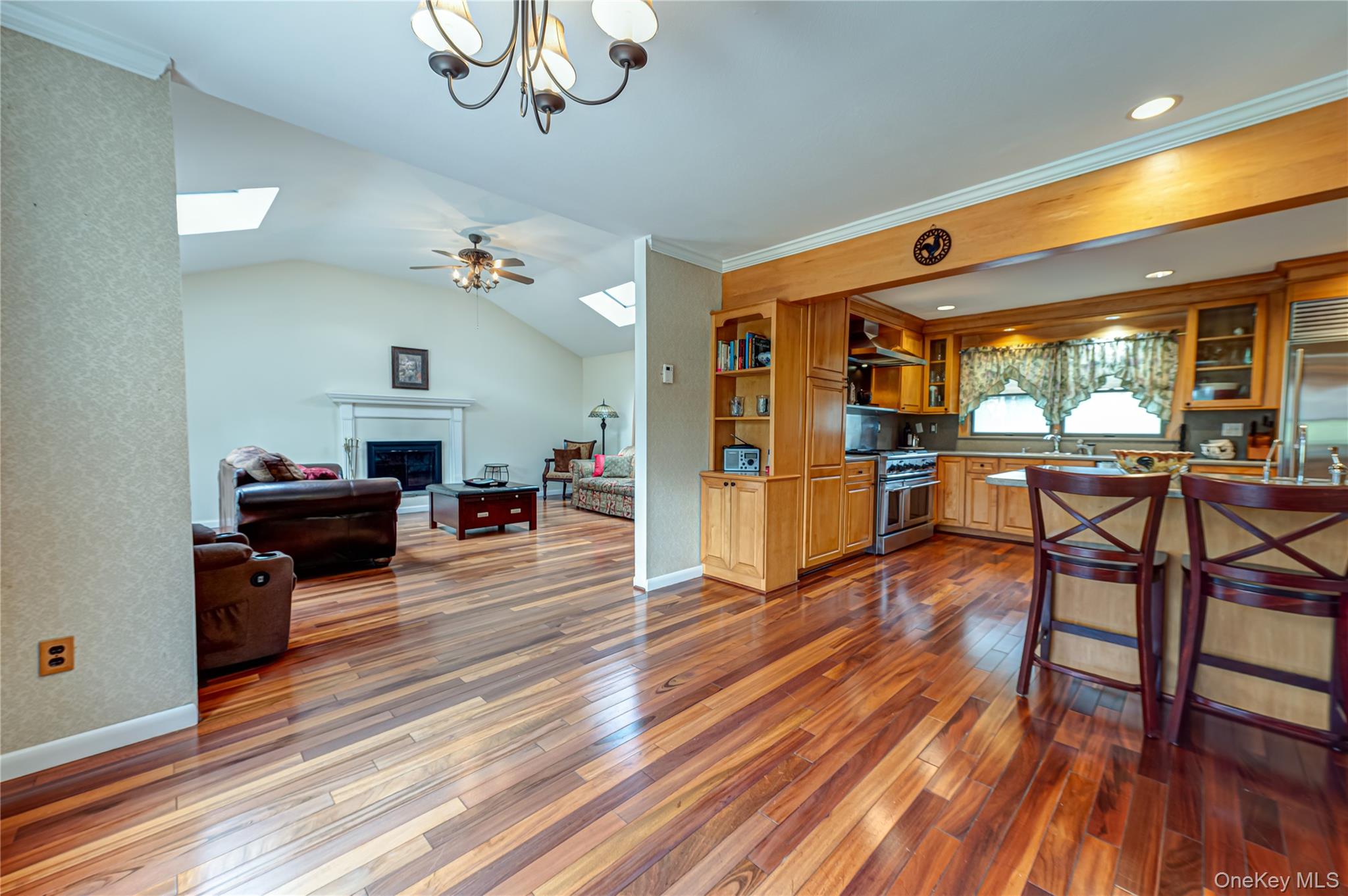 114 Randall Road Ridge, NY 11961 - Photo 10 of 48 a living room with furniture a fireplace and wooden floor