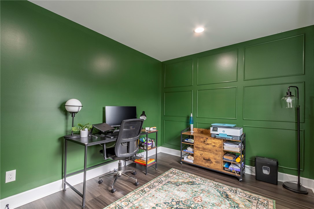 3080 McGee Road Iva, SC 29655 - Photo 16 of 49 Bold green walls and panel molding create a stimulating and productive atmosphere in this home office.