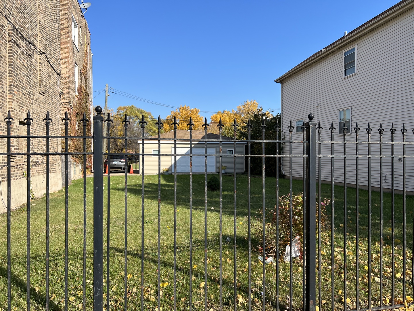 a view of outdoor space and iron fence