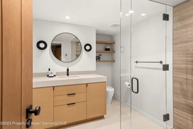 a living room with furniture and flowers