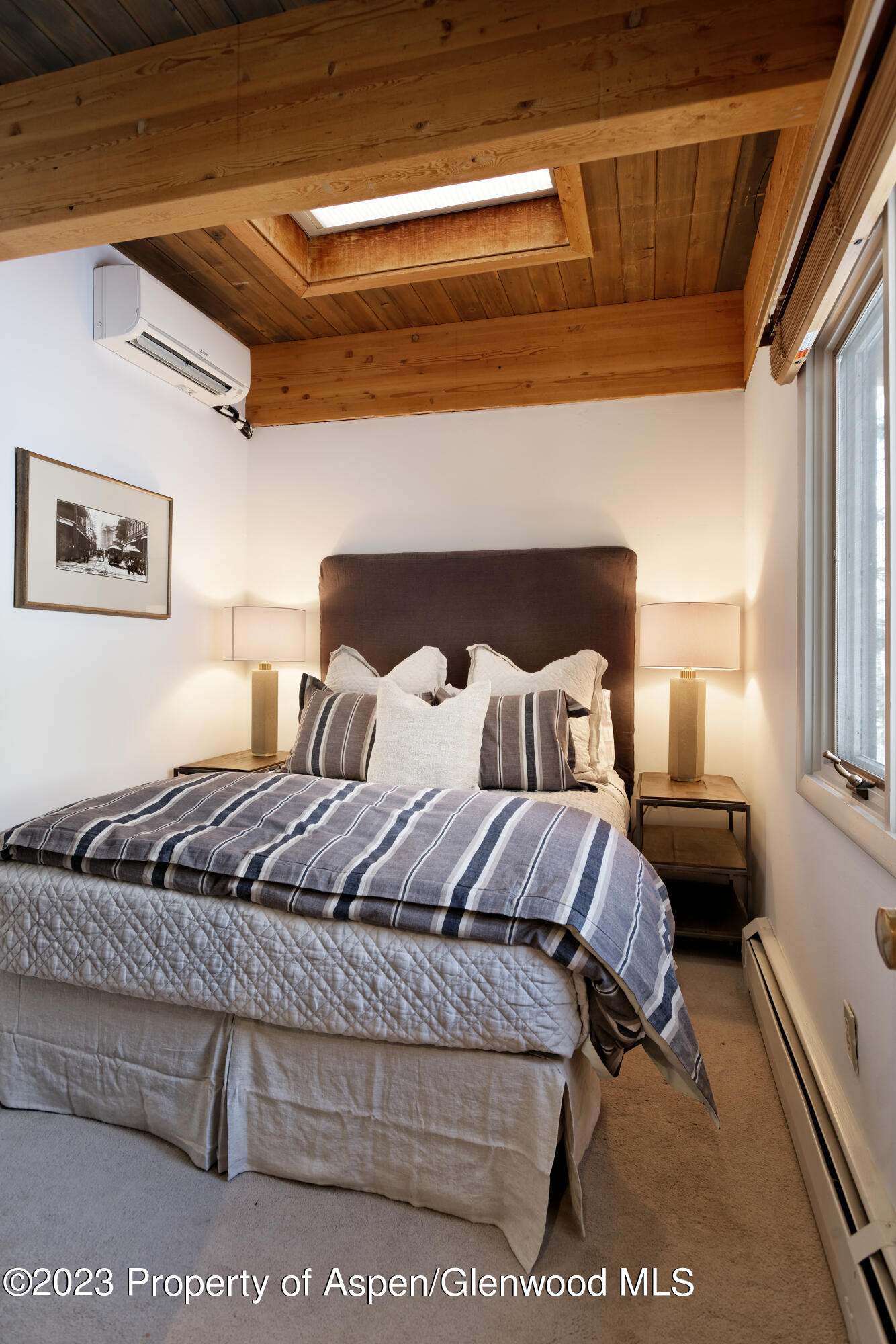 164 Eastwood Road Aspen, CO 81611 - Photo 22 of 42 a bed sitting in a bedroom next to a window