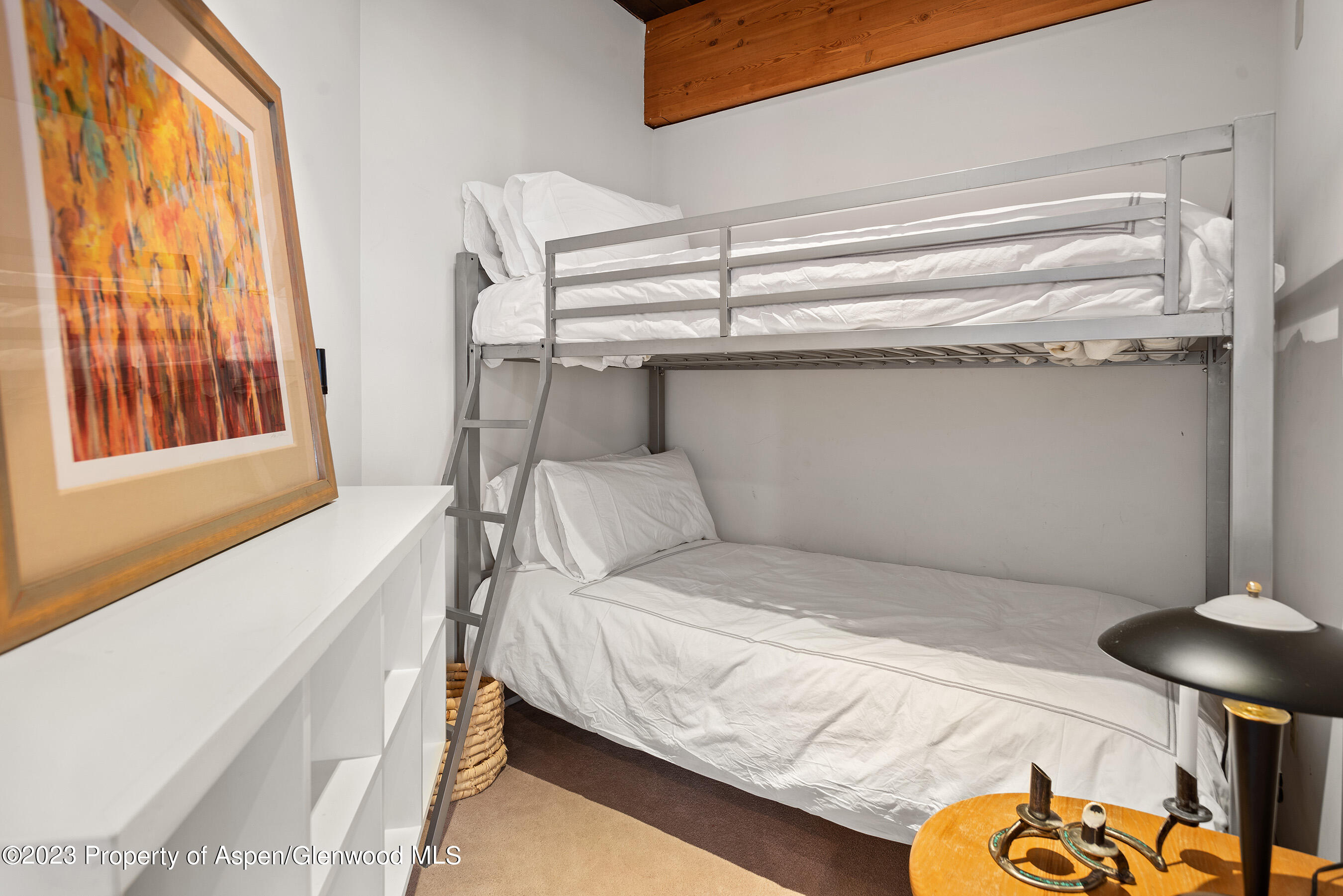 164 Eastwood Road Aspen, CO 81611 - Photo 24 of 42 a bedroom with a bed and a window