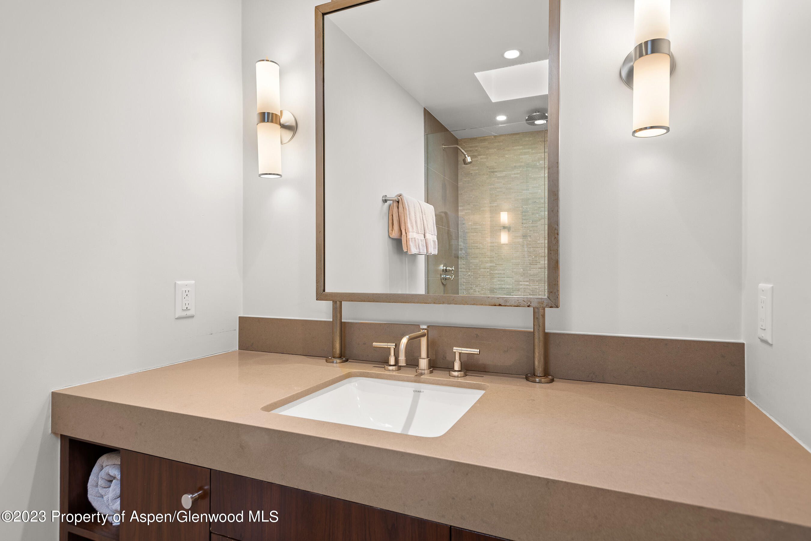 164 Eastwood Road Aspen, CO 81611 - Photo 26 of 42 a bathroom with a sink and a mirror