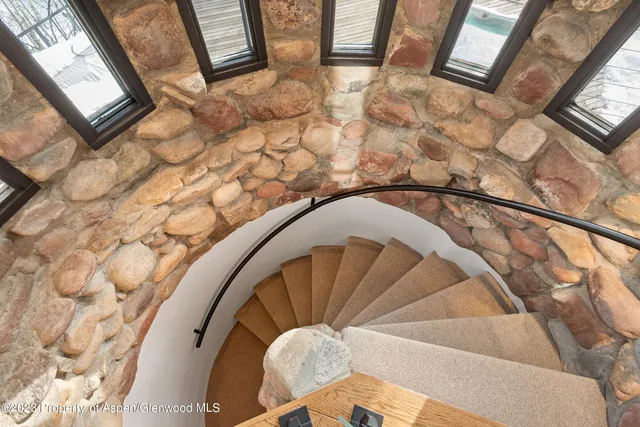 a view of a balcony with chairs