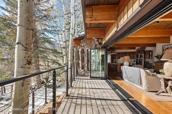 a view of a balcony with wooden floor