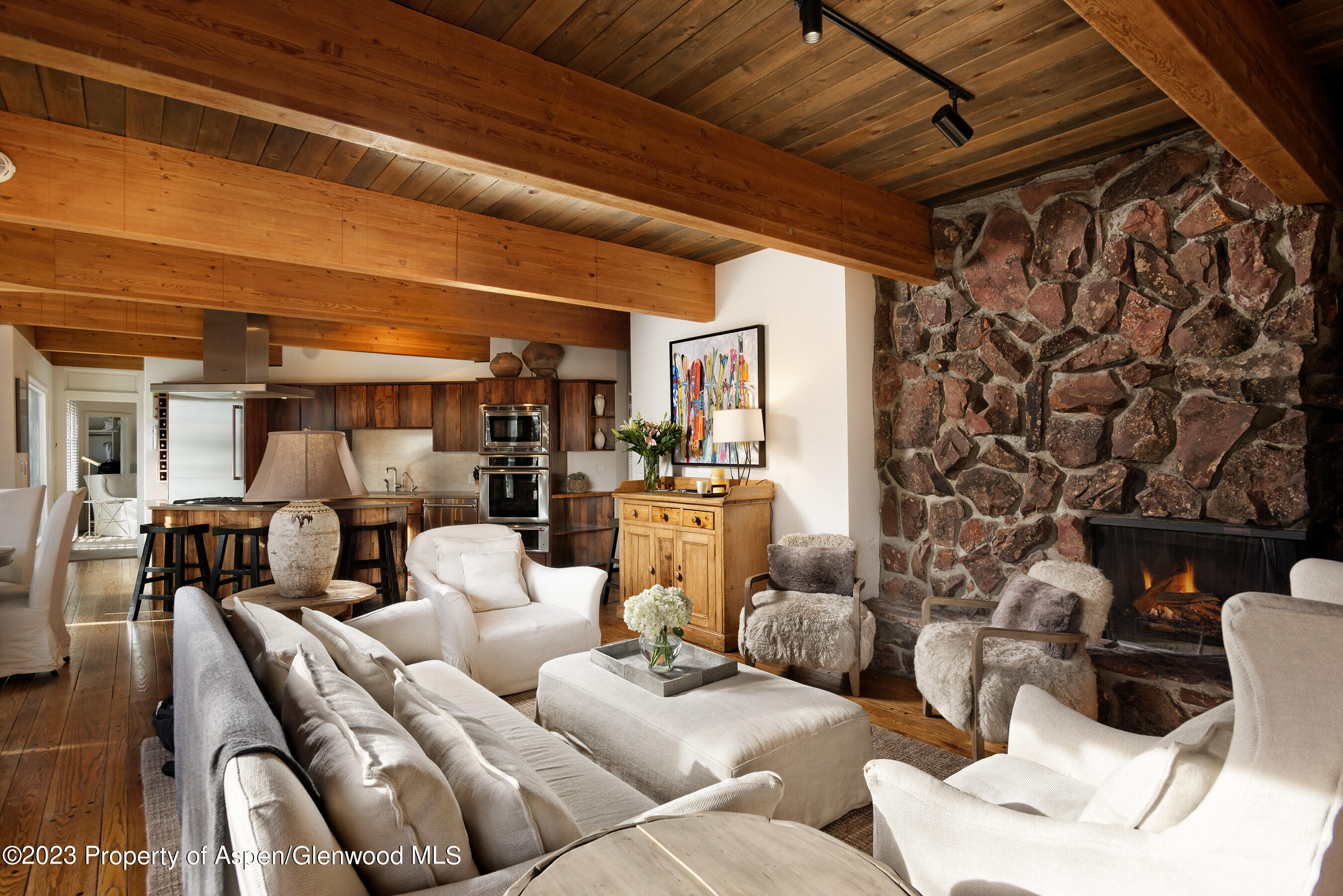 164 Eastwood Road Aspen, CO 81611 - Photo 4 of 42 a living room with furniture and a fireplace