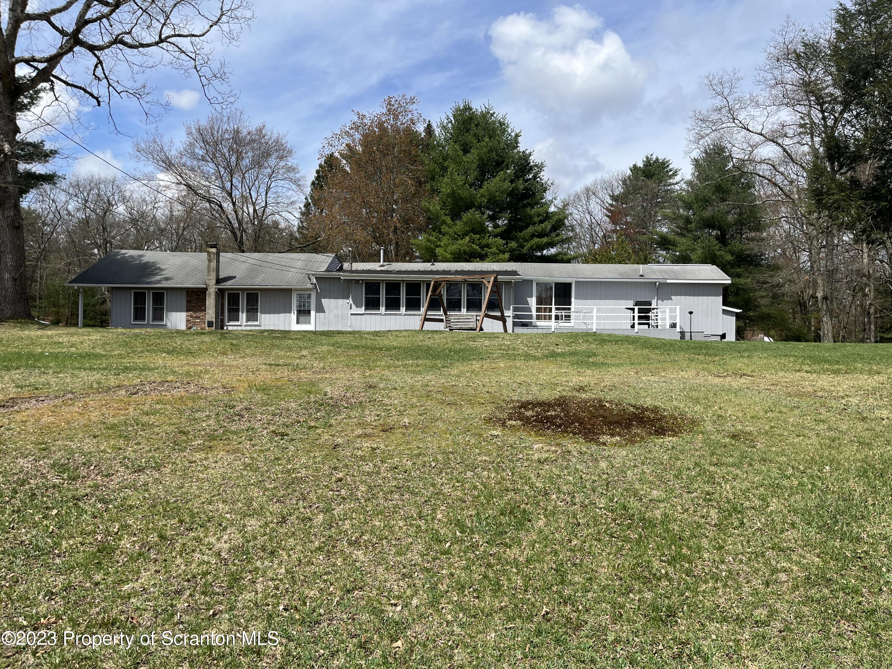 101 Welcome Lake Road Beach Lake, PA 18405 - Photo 3 of 22 a view of a house with yard and sitting area