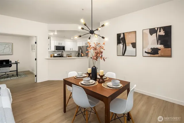 a view of a dining room with furniture and wooden floor