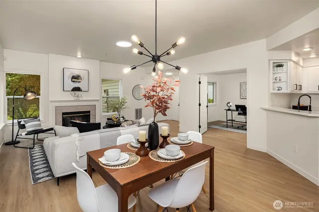 a view of a dining room with furniture and a fireplace