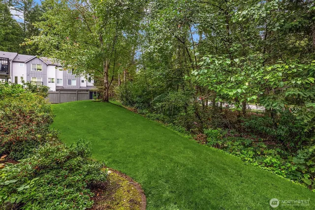 a aerial view of a house with a yard