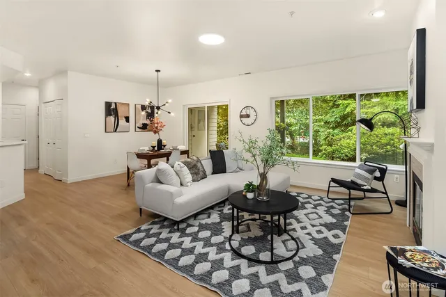 a living room with furniture and a large window