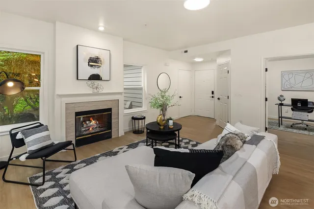 a living room with furniture fireplace and a flat screen tv