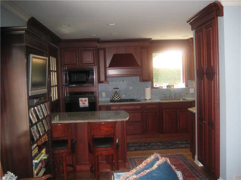 6 Northridge Road Old Greenwich, CT 06870 - Photo 14 of 14 a kitchen with stainless steel appliances granite countertop a refrigerator and a sink