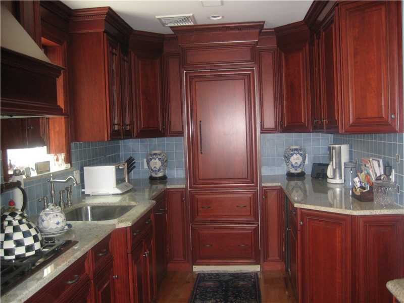 6 Northridge Road Old Greenwich, CT 06870 - Photo 4 of 14 a kitchen with granite countertop stainless steel appliances and wooden cabinets