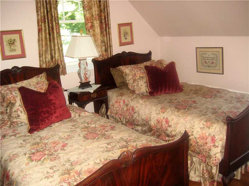 6 Northridge Road Old Greenwich, CT 06870 - Photo 10 of 14 a large bed sitting in a bedroom next to a window