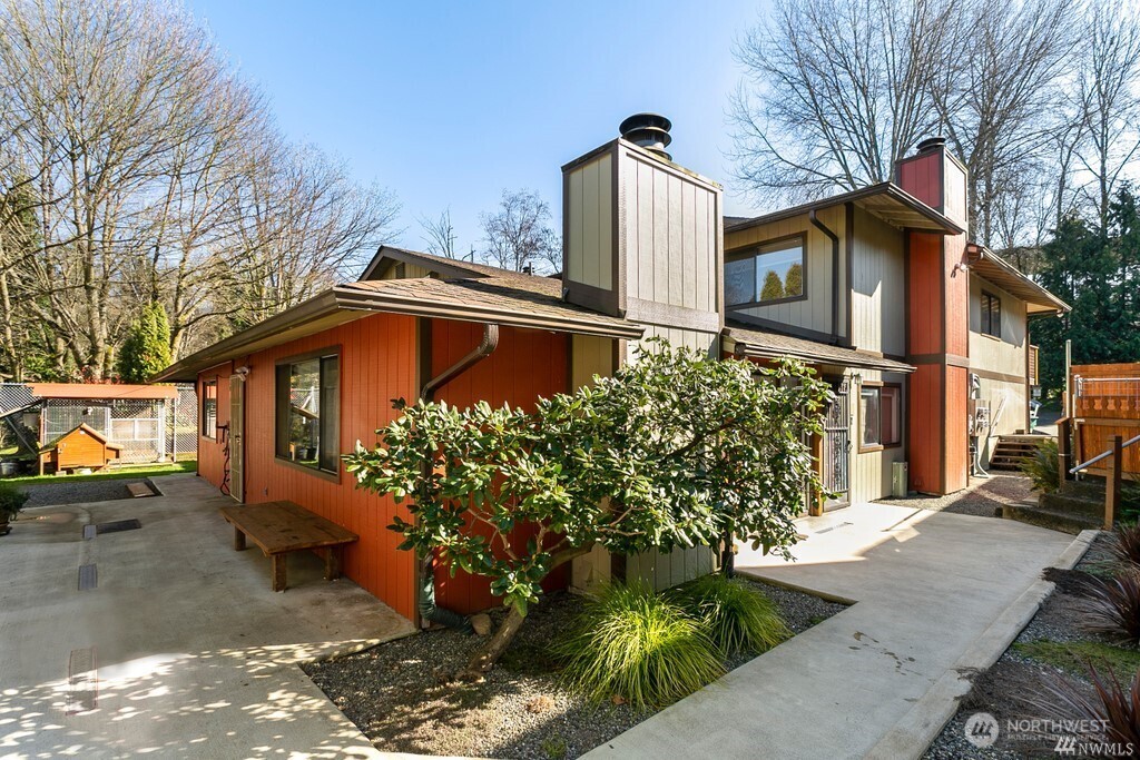 15422 40th Avenue South, Unit C Tukwila, WA 98188 - Photo 1 of 10 a front view of a house with garden