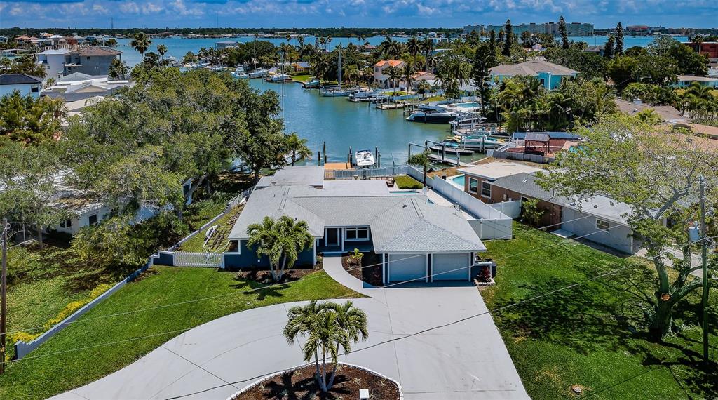 an aerial view of a house with a yard basket ball court and outdoor seating