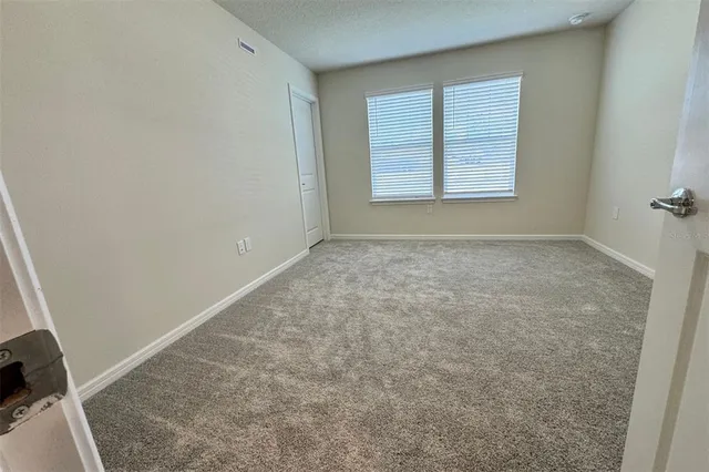 a bathroom with a double vanity sink toilet and shower
