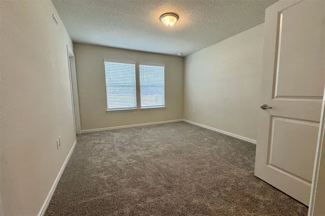 a bathroom with a shower and a glass door