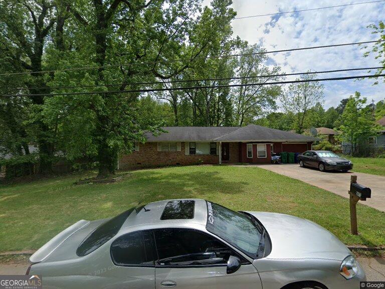 a car parked in the front of a house