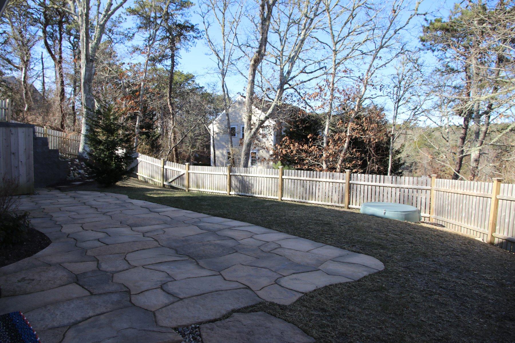50 Katie Ford Road Chatham, MA 02633 - Photo 23 of 29 Fenced in backyard with stone patio