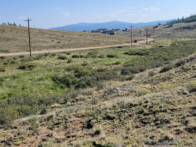 a view of a yard with a mountain