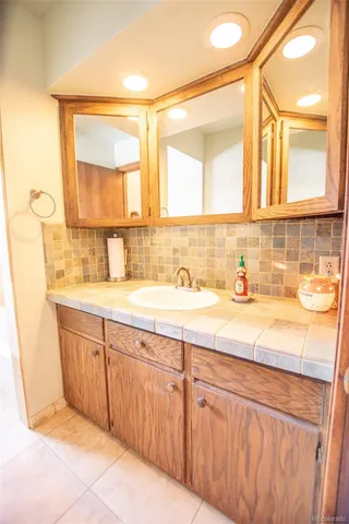 a bathroom with a sink and a mirror