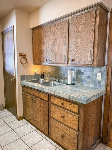 a kitchen with a sink and cabinets