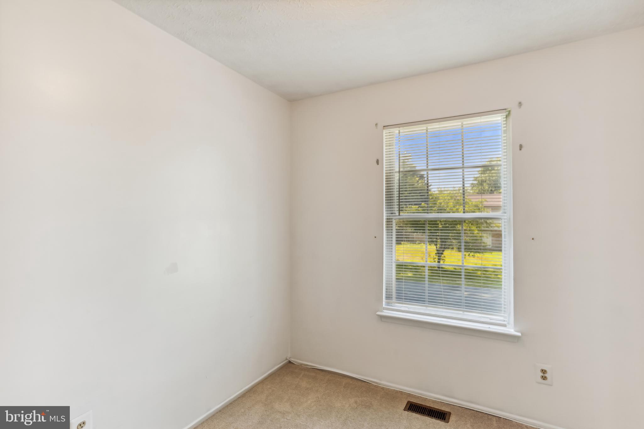 8225 Grainfield Road Severn, MD 21144 - Photo 22 of 35 a view of an empty room with a window
