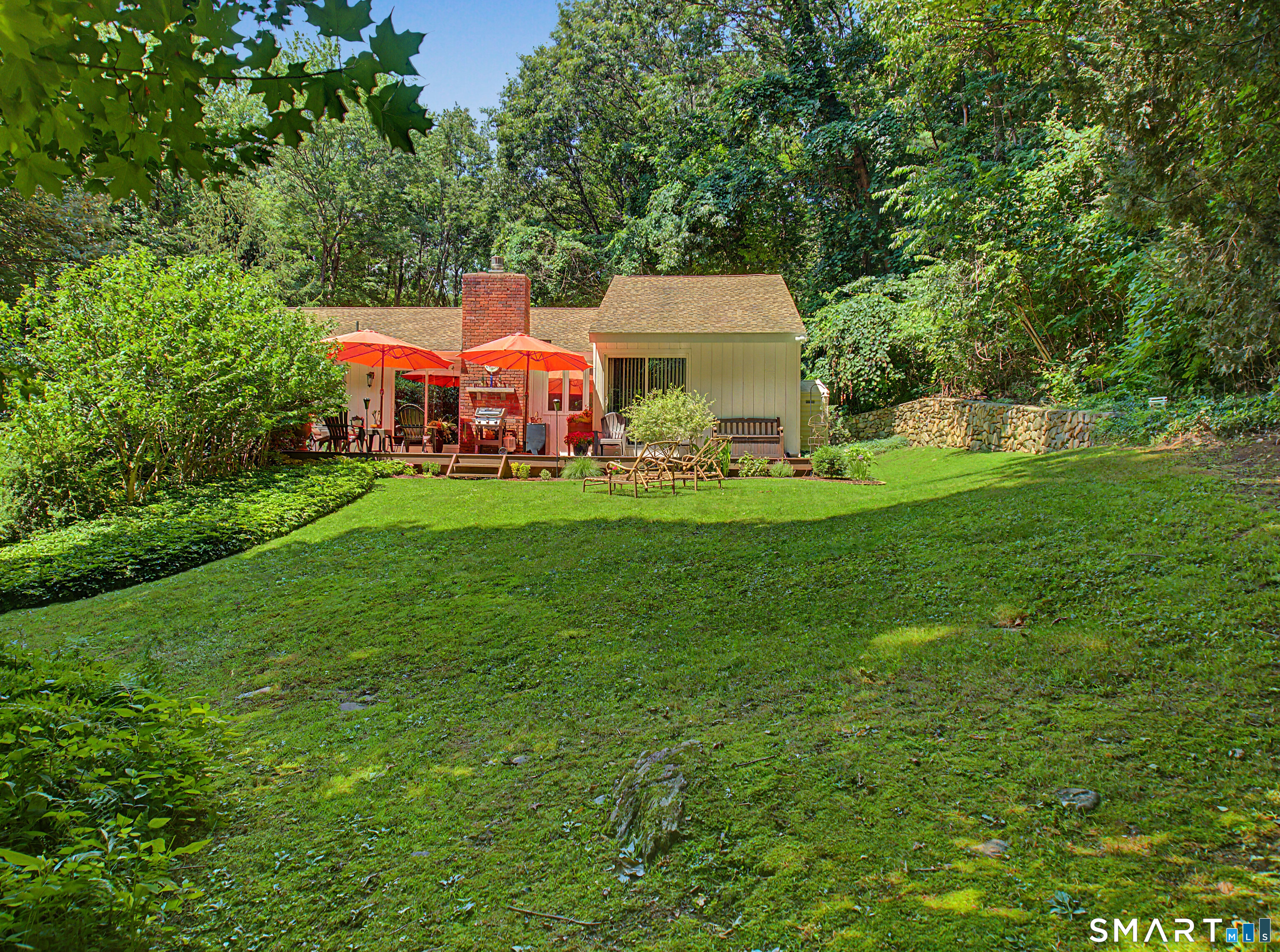 270 Bound Line Road Wolcott, CT 06716 - Photo 4 of 40 a front view of a house with a garden and trees