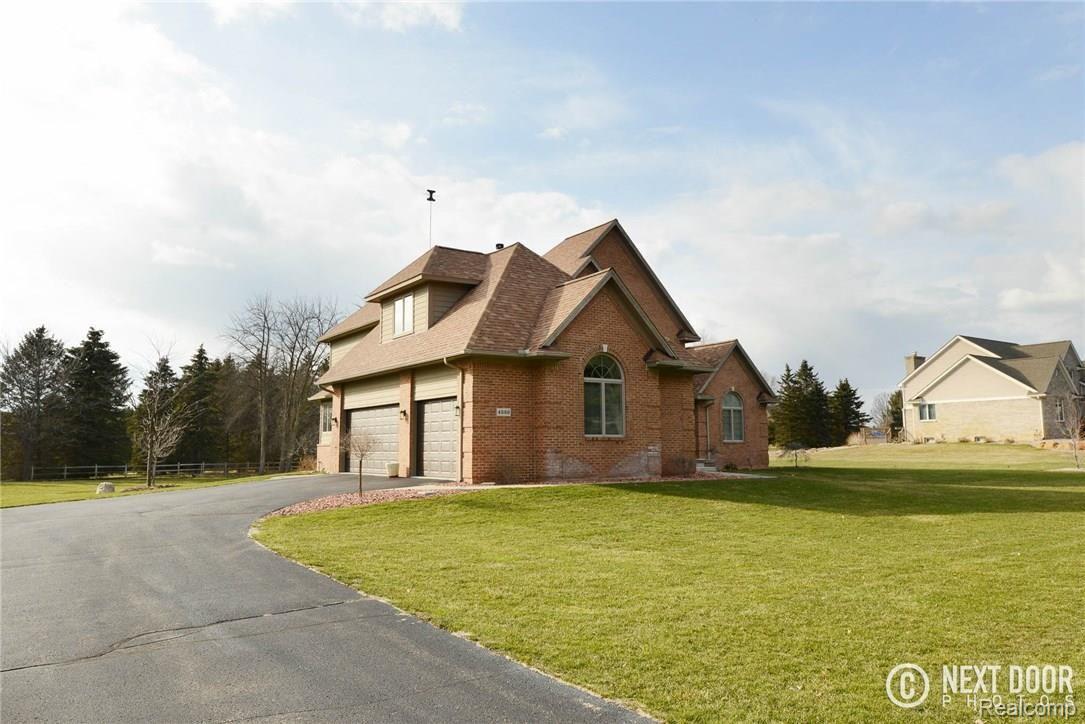 4886 Pleasant Valley Road Brighton, MI 48114 - Photo 2 of 51 3 car garage with new insulated doors.