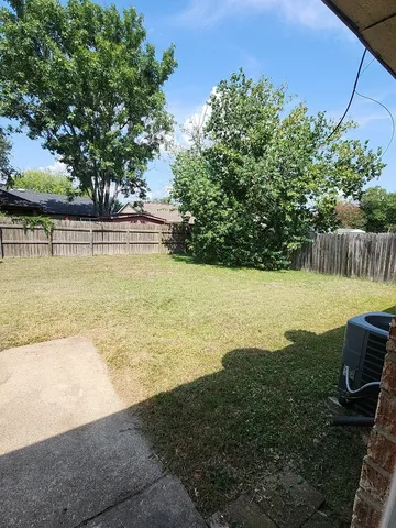 a view of a swimming pool with an outdoor space and seating area