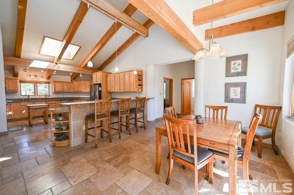 49 Pinon Drive Smith Valley, NV 89444 - Photo 16 of 45 a dining room with furniture and a kitchen view