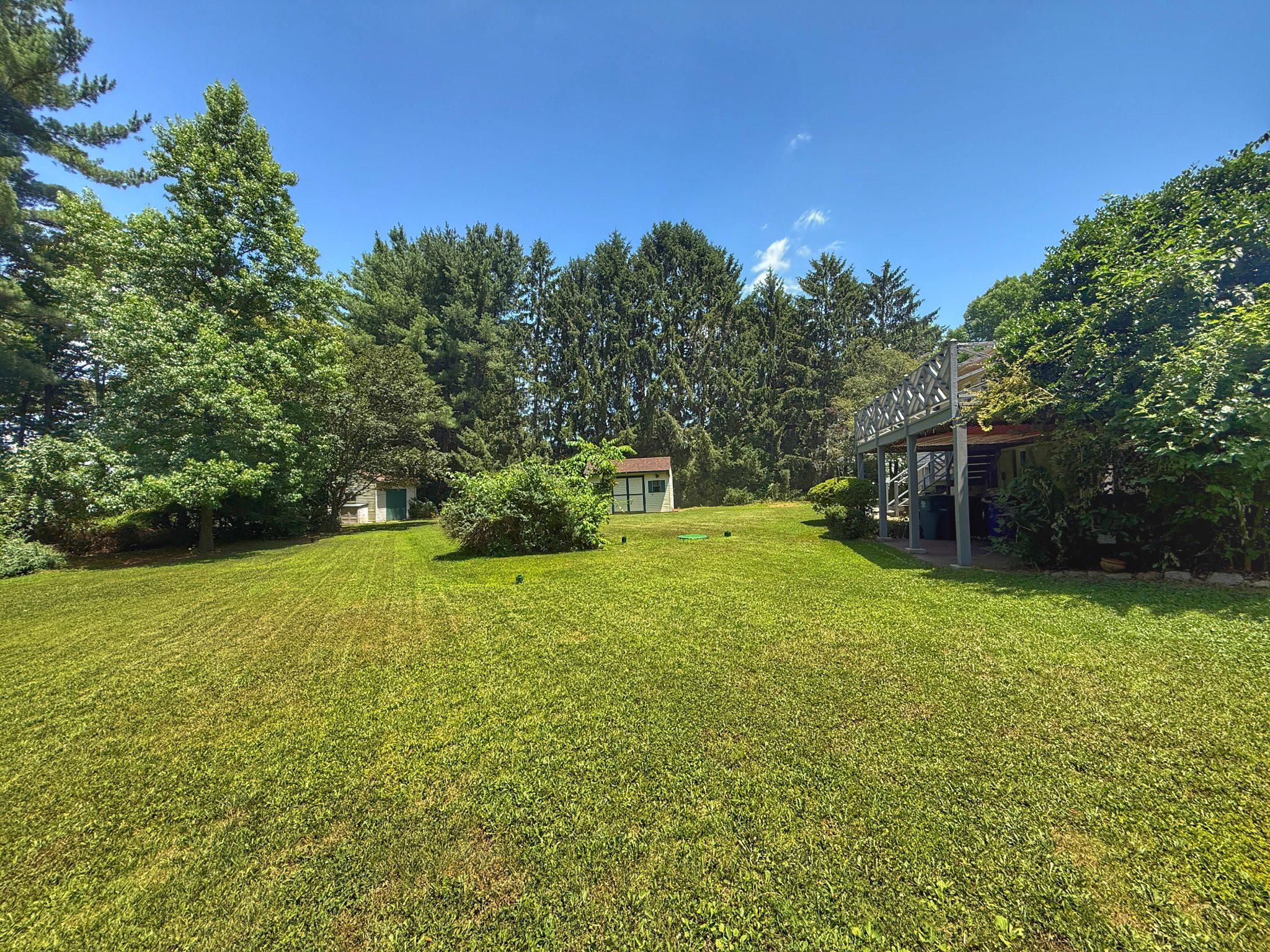 4 Martz Road Sykesville, MD 21784 - Photo 5 of 12 a yellow house with swimming pool in front of it