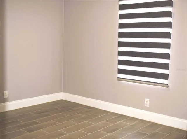 a view of an empty room and window