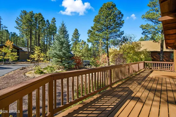 a view of balcony with wooden floor