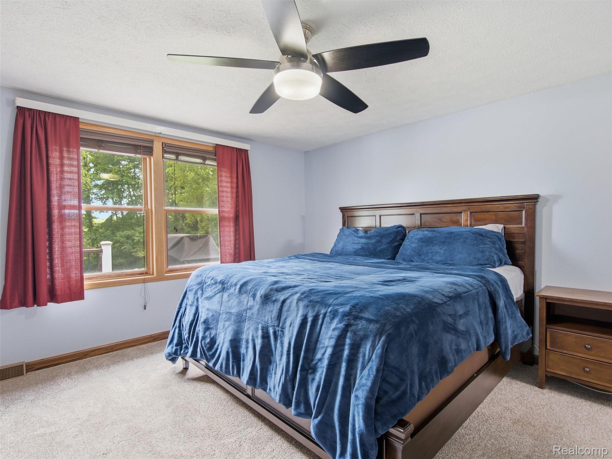 5003 Mason Road Howell, MI 48843 - Photo 18 of 59 Light-colored carpeting complementing soft blue wall tones