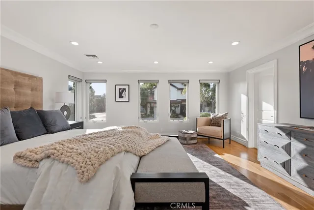 a spacious bedroom with a bed and a couch