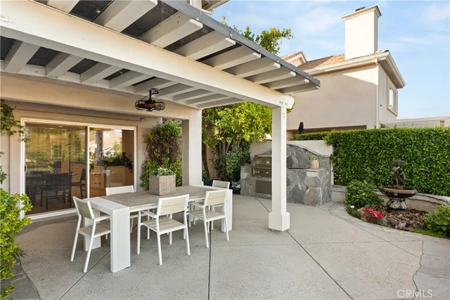 a view of a lake with a table and chairs